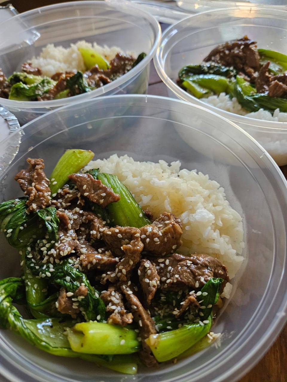 Beef and bok choy with steamed rice and sesame seeds