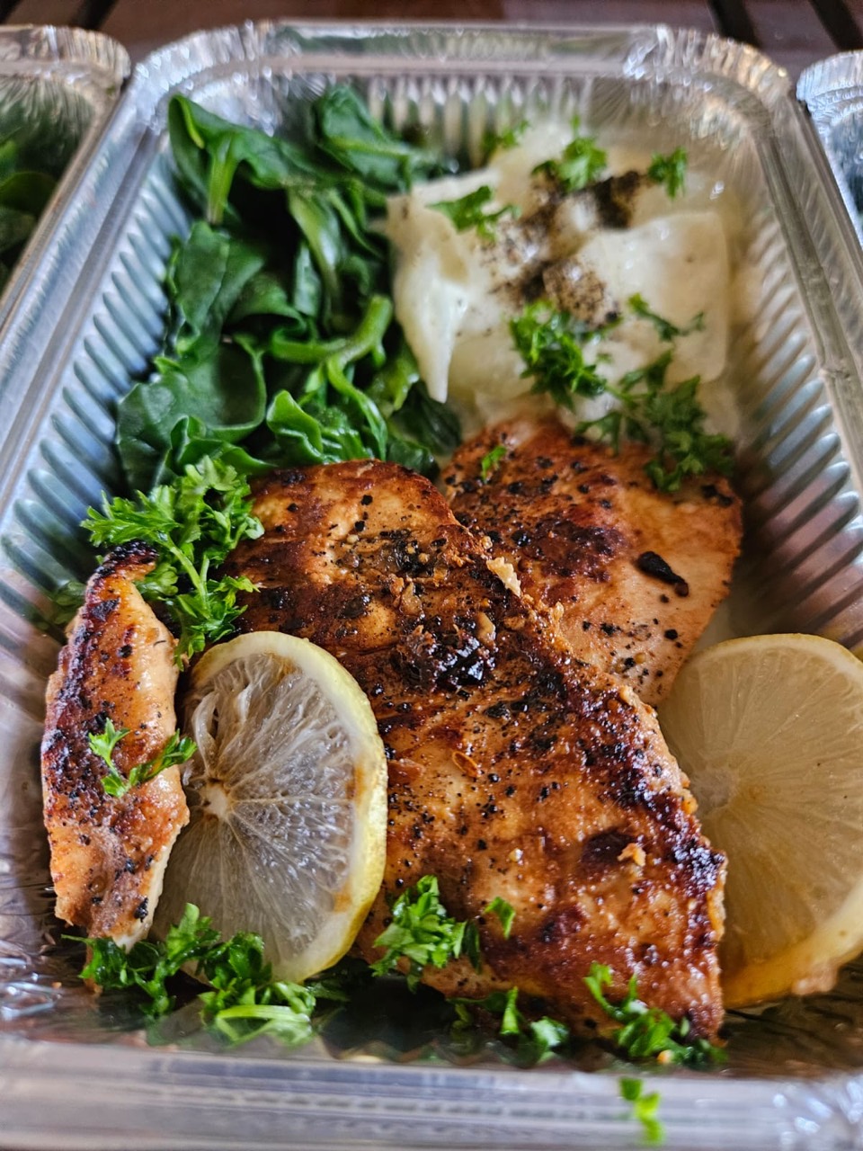 Lemon chicken with spinach and a creamy vegetable side